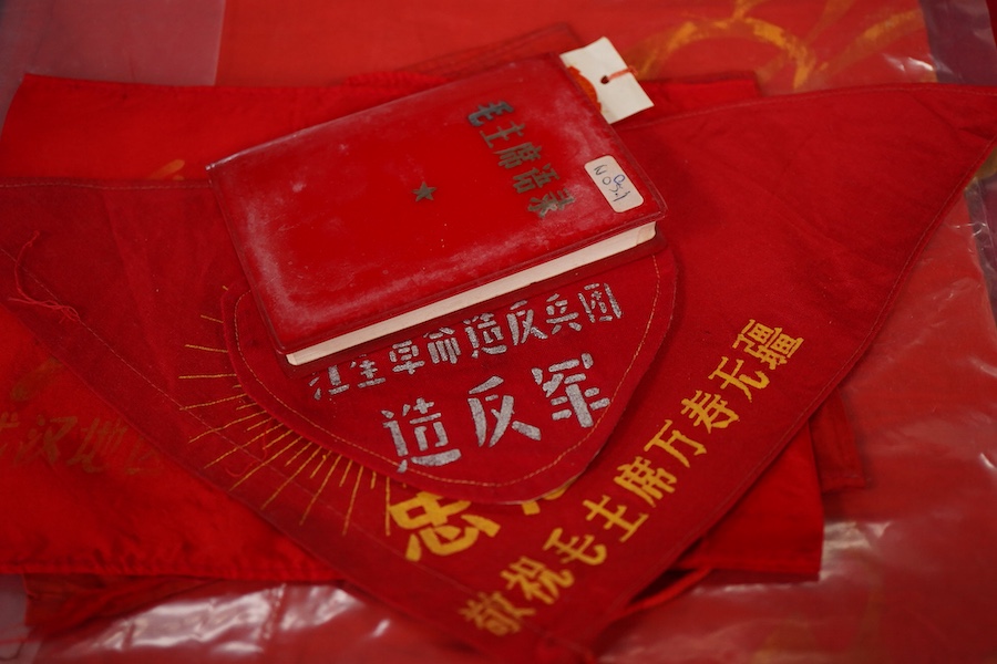 A Chinese Cultural Revolution flag, three armbands, a red book, a badge and a small flag-85cm wide x 102cm long